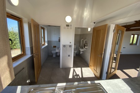Kitchen with toilet and disabled toilet.