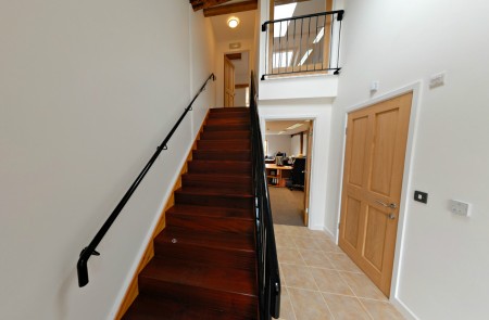 Staircase leading to the upper office.